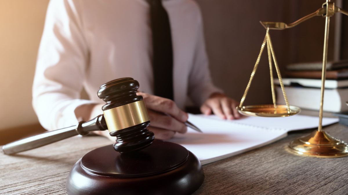 A lawyer writing on his desk