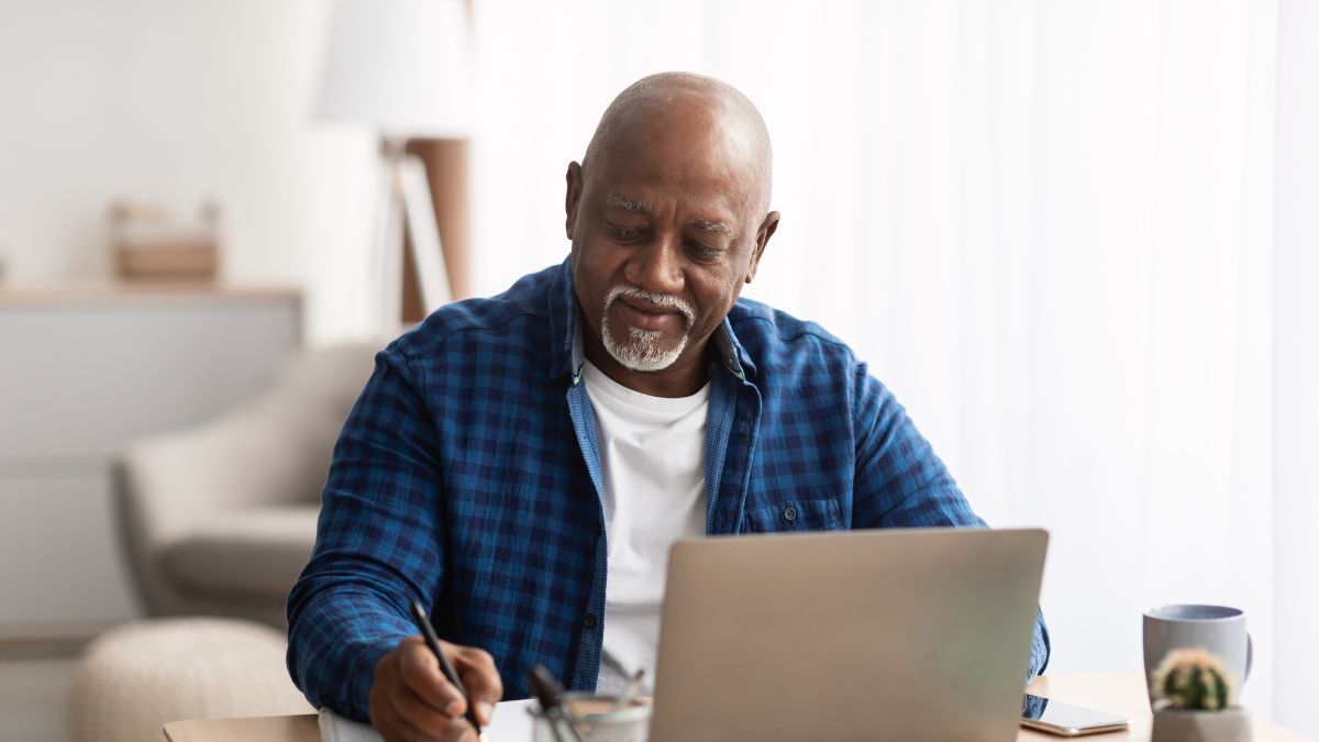 A man writing down notes