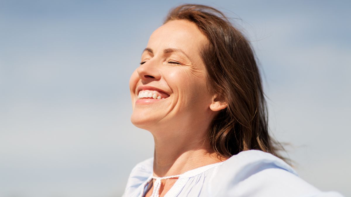 a woman feeling the wind