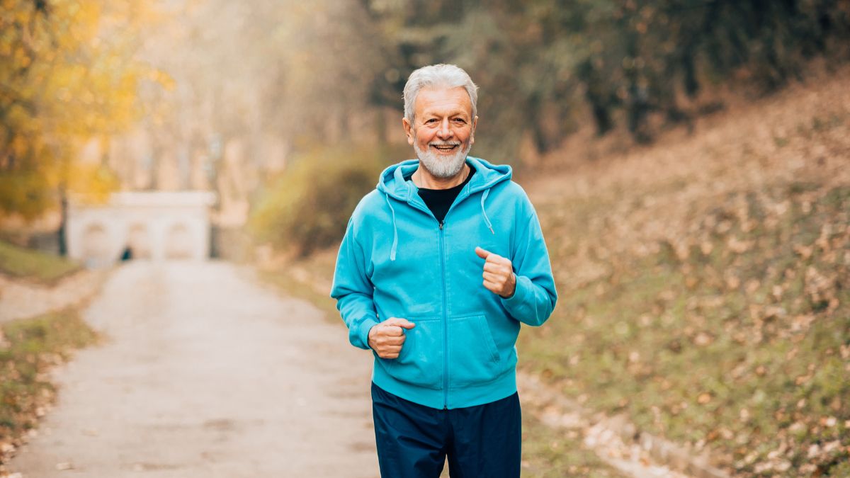 A man happily hiking